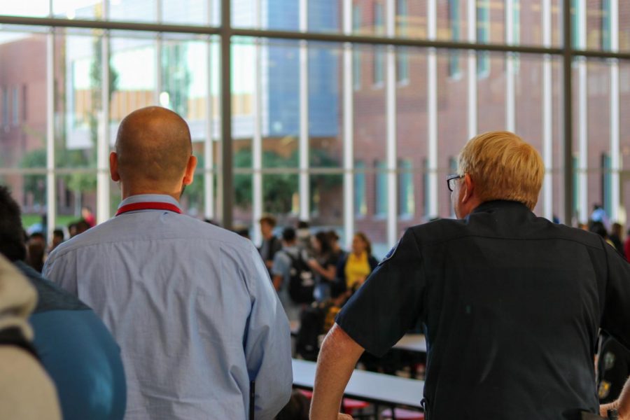 Mr. Schaffer, an intern assistant principal, and Officer Hoffman keep an eye on Lancers during lunch. 