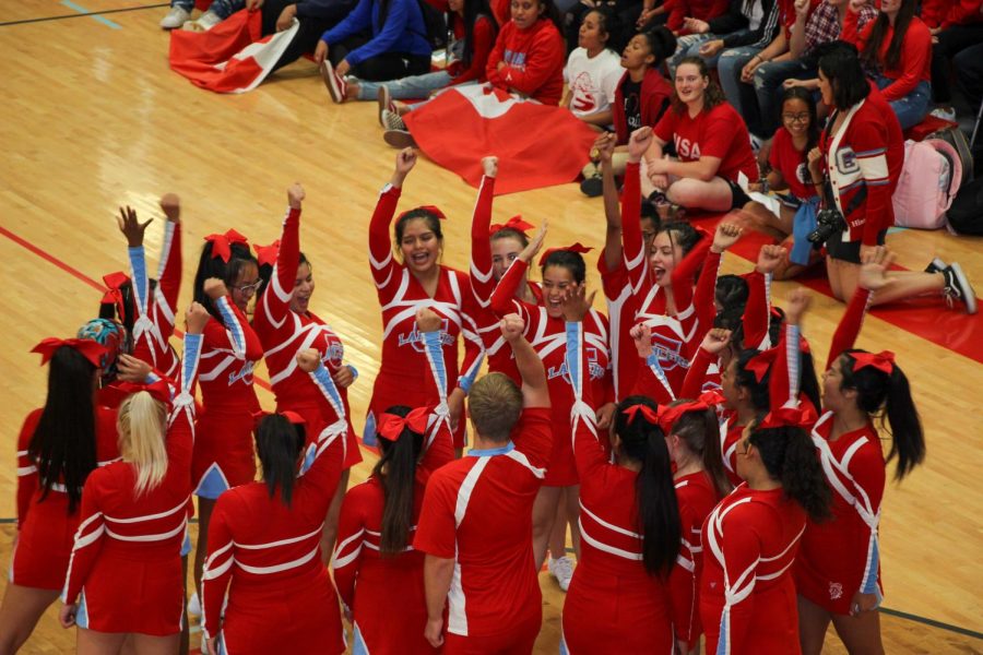 Granger+Highs+cheerleaders+prepare+for+their+aerial+stunts+at+the+homecoming+spirit+assembly.+