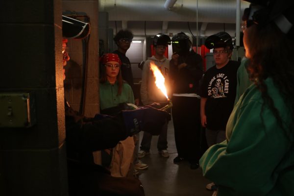 Mr. Murillo demonstrates oxygen/acetylene cutting to intermediate students.

