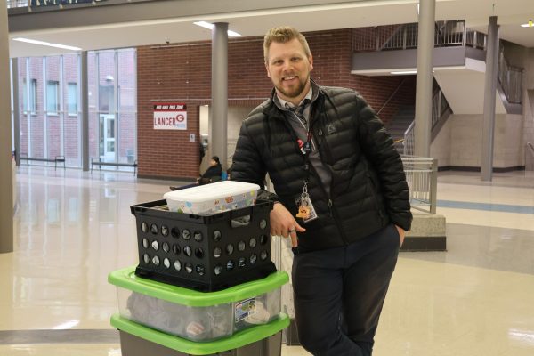 Mr. Black's LIA students wear the ID vests in these crates when tutoring.