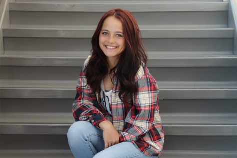 Taylor Hensley poses on stairs