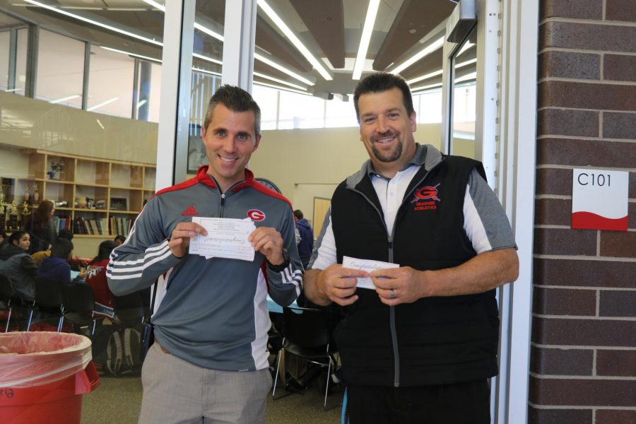Mr. Beck and Dr. Dun collect lunch tickets at Panda Express Celebration. 